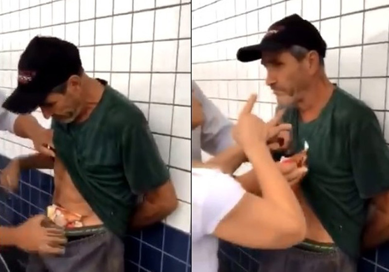 Vanderlei com a comida e sendo agredido - Foto: Reprodução/Twitter||