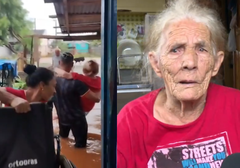 O neto carregou a avó cadeirante no colo para tirá-la da casa que ficou toda alagada. - Foto: G1.