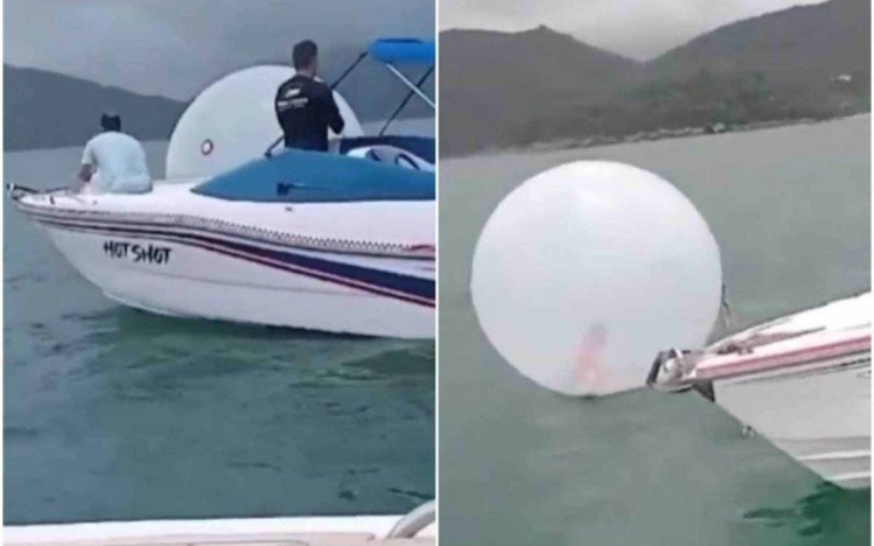 O marinheiro e dois colegas salvam a criança, que estava dentro de uma bolha inflável plástica, em alto-mar em Ubatuba, SP. - Foto: Correio Braziliense