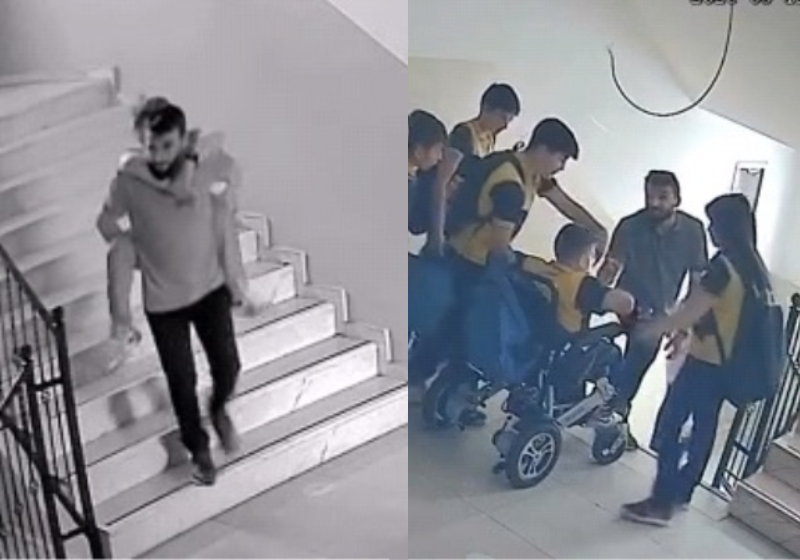 O diretor pegou o aluno cadeirante no colo e desceu as escadas com ele. - Foto: reprodução en.harbeler.com